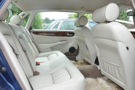 Our Jaguars are all matching Sapphire Blue with Light Leather interior.